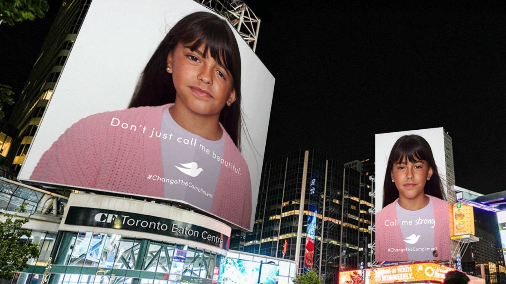 Bild eines Mädchens auf zwei Werbetafeln. Auf der linken steht „Don't just call me beautiful“ und auf der rechten “Call me strong“.